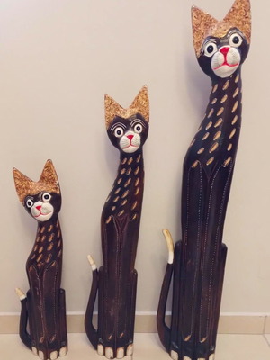 Set of handmade wooden cats used