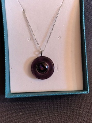 Necklace with hematite wheel-shaped pendant like new