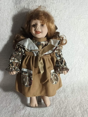 Vintage porcelain doll 32cm with Teddies dress like new