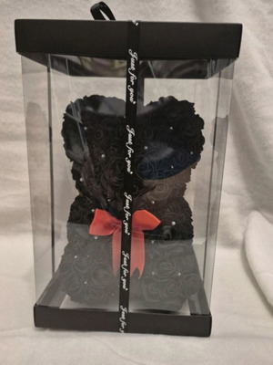 Bear made of artificial black leaves with small diamonds
