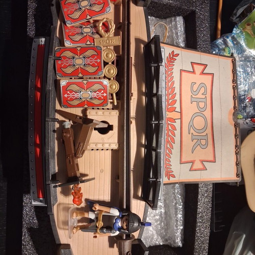 Playmobil Roman set used with character, gun, helmet, shields, boat, and horses