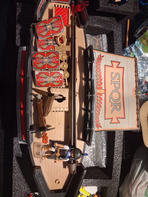 Playmobil Roman set used with character, gun, helmet, shields, boat, and horses