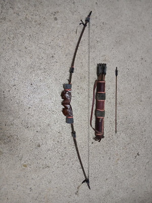 Decorative wooden carved bow with arrows like new