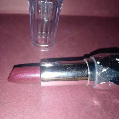 Purple lipstick shiny new with subtle glitter