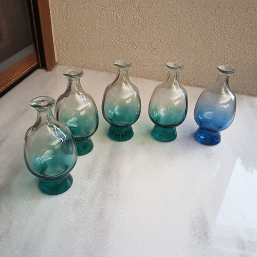 Glass bottles set of 5, 4 green and 1 blue, no corks