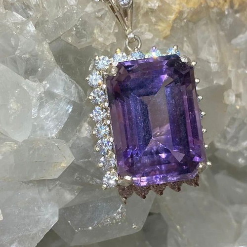 Silver pendant with large cut natural amethyst stone and moissanites