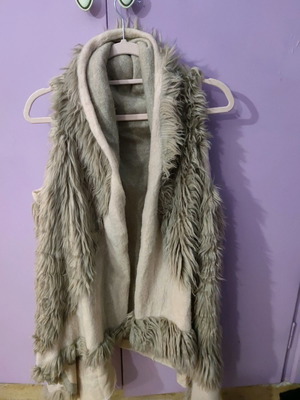 Asymmetric fur vest used, beige and sugar shades