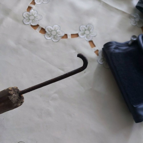 Vintage tool used, wooden part damaged, likely screwdriver