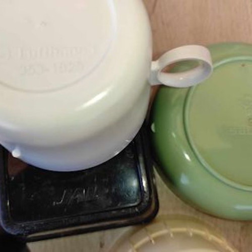 Collection of used airplane food containers, set of 31, airline brands