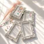 Vintage plaster frame with perfume bottle