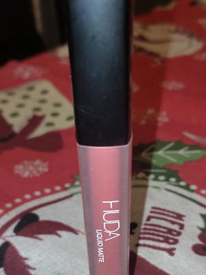 Huda Beauty liquid matte lipstick used, pink-rose shade