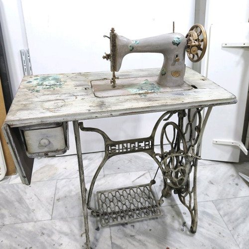 Singer sewing machine decorated with decoupage and aging, used