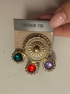 Vintage pin used with colored stones gold tone