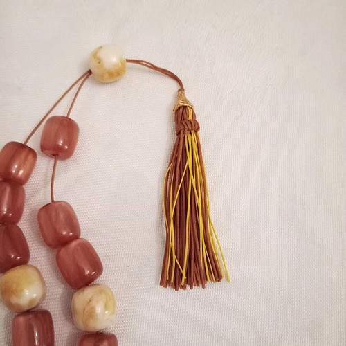 Worry beads with synthetic resin beads in orange color like new