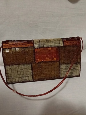 Official hand bag like new in brown shades with sequins