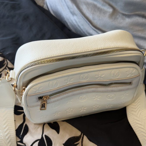 White bag with gold details and unique design, new