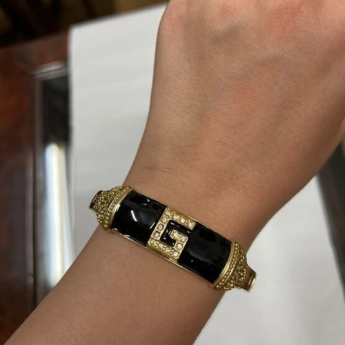 Bracelet like new with black and gold design
