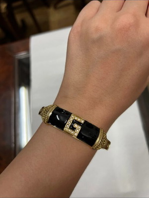Bracelet like new with black and gold design