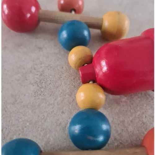 Vintage wooden stroller toy.