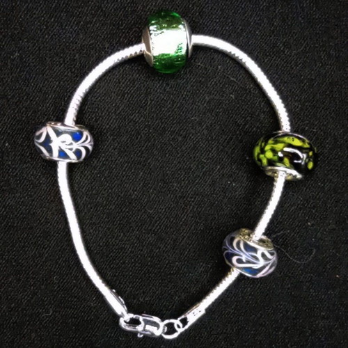 Silver 925 bracelet like new with 4 charms, 20 cm length