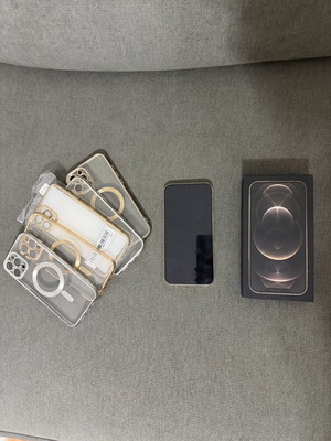 Iphone 12 Pro Max gold like new with cases and charger