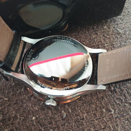 Tissot Classic Gent watch with 18k gold bezel, quartz, new