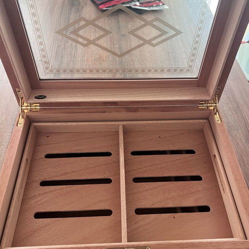 Cigar accessories like new with cedar humidifier, Colibri cutter and Xikar hygrometer