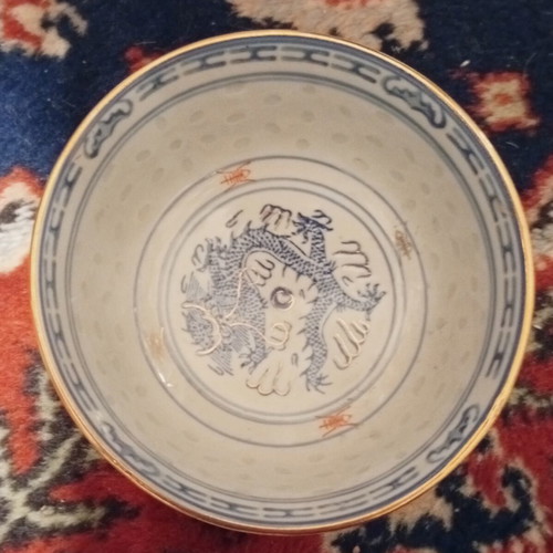 Classic Chinese rice porcelain bowl with dragon motif