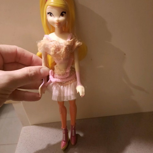 Winx doll used with slightly torn top