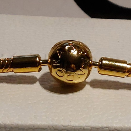 Pandora bracelet size 18 cm, gold plated with round clasp