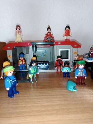 Various Playmobil figures used with fire station and boat