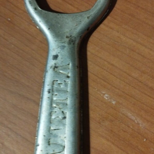 Vintage Amstel beer opener used with Greek inscription