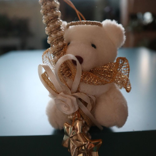 Christmas teddy bear like new with golden caramel and feathers