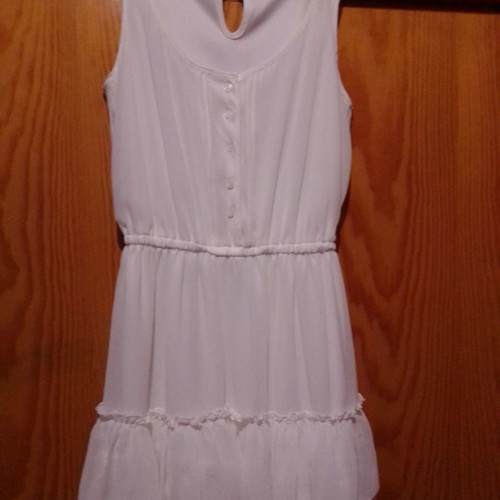 Two white dresses used, sizes 12-14 for girls