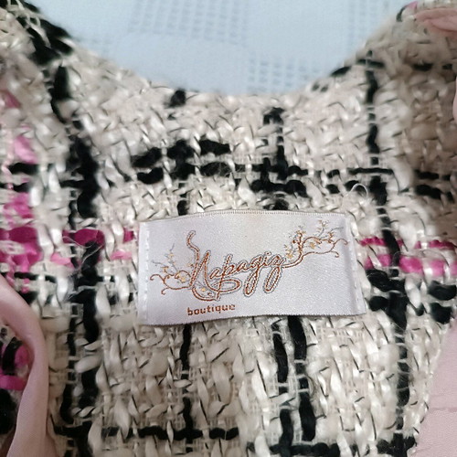 Coat used, no collar, fastens with studs, size M, white multicolor