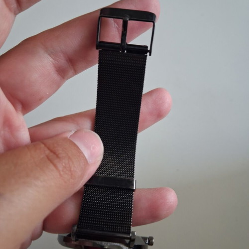 Geneva wristwatch used with black mesh metal strap