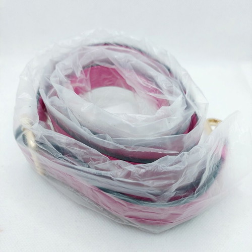 Adjustable bubblegum pink bag strap