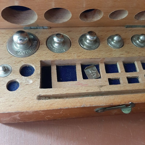 Wooden collectible box with cast iron weights
