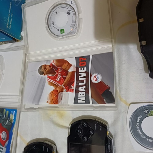 Sony PSP handheld consoles with accessories and games