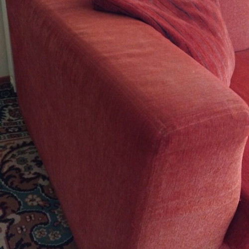 Two-seater sofa used with set of 2 cushions