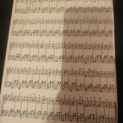 Piano music learning book used with melodic exercises and song sheet music