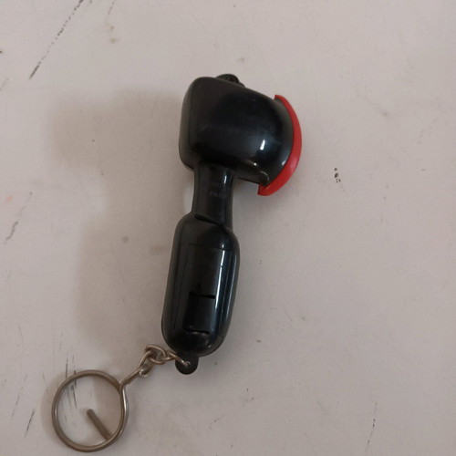 Axe keychain like new, makes sound when hit, black