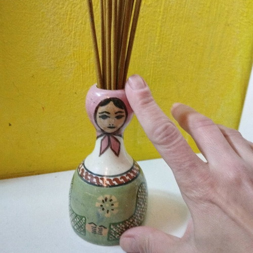 Ceramic vase used with folk costume for aromatic sticks