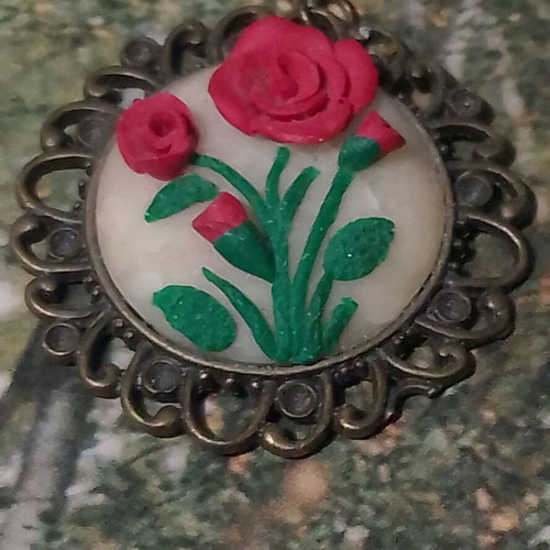 Handmade rose pendant with bronze frame