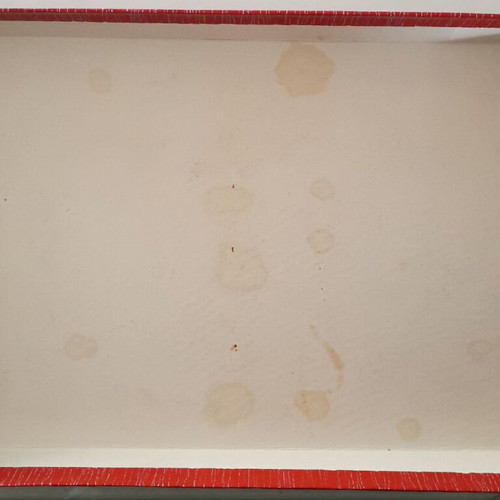 Ideal cardboard chocolate box used with torn corners on lid
