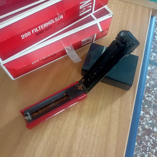 Cigarettes and tobacco roller with case like new