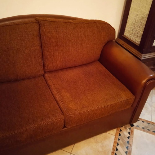 Two-seater sofa used, leatherette with fabric