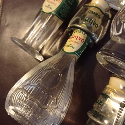 Miniature liquor bottles used, collection of 8 shaped like musical instruments