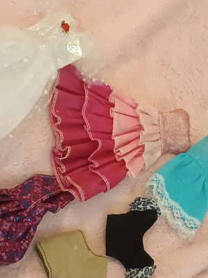 Doll clothes used with white dress with defects