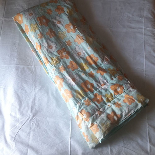 Single quilt used with two sides, floral and blue